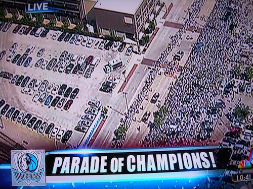 Dallas Mavericks shooting guard Jason Terry shows his tattoo off to fans  during the Dallas Mavericks parade at the American Airlines Center.