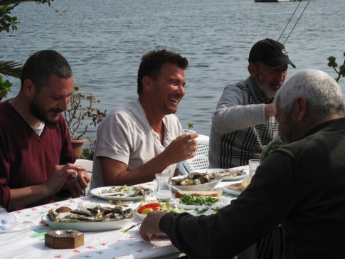 Booze Traveler_Turkey_Host Jack Maxwell sharing a meal and a glass of Raki with the local fishermen