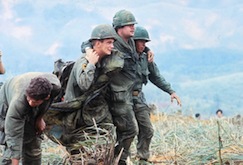 two-us-soldiers-aiding-wounded-vietnam